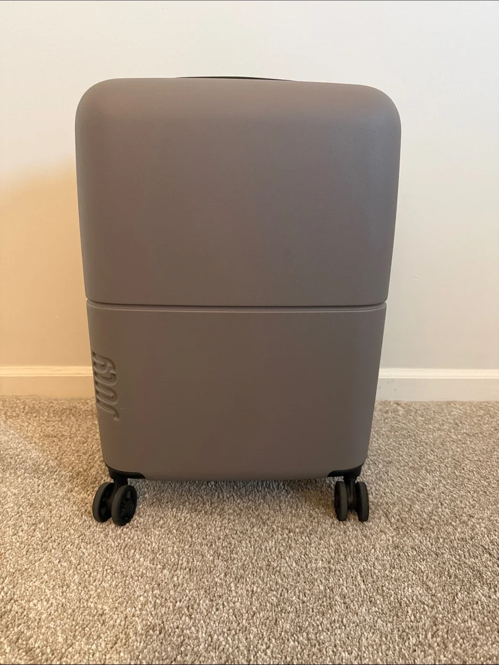 Compact Beige Rolling Storage Case with Smooth Wheels